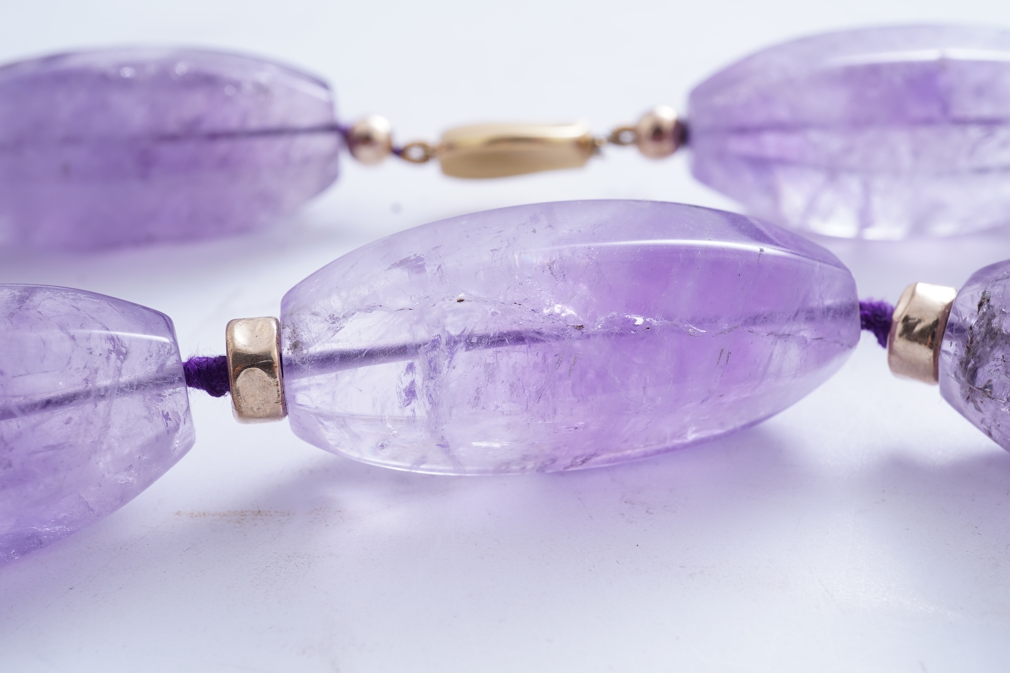 An amethyst and gold necklace